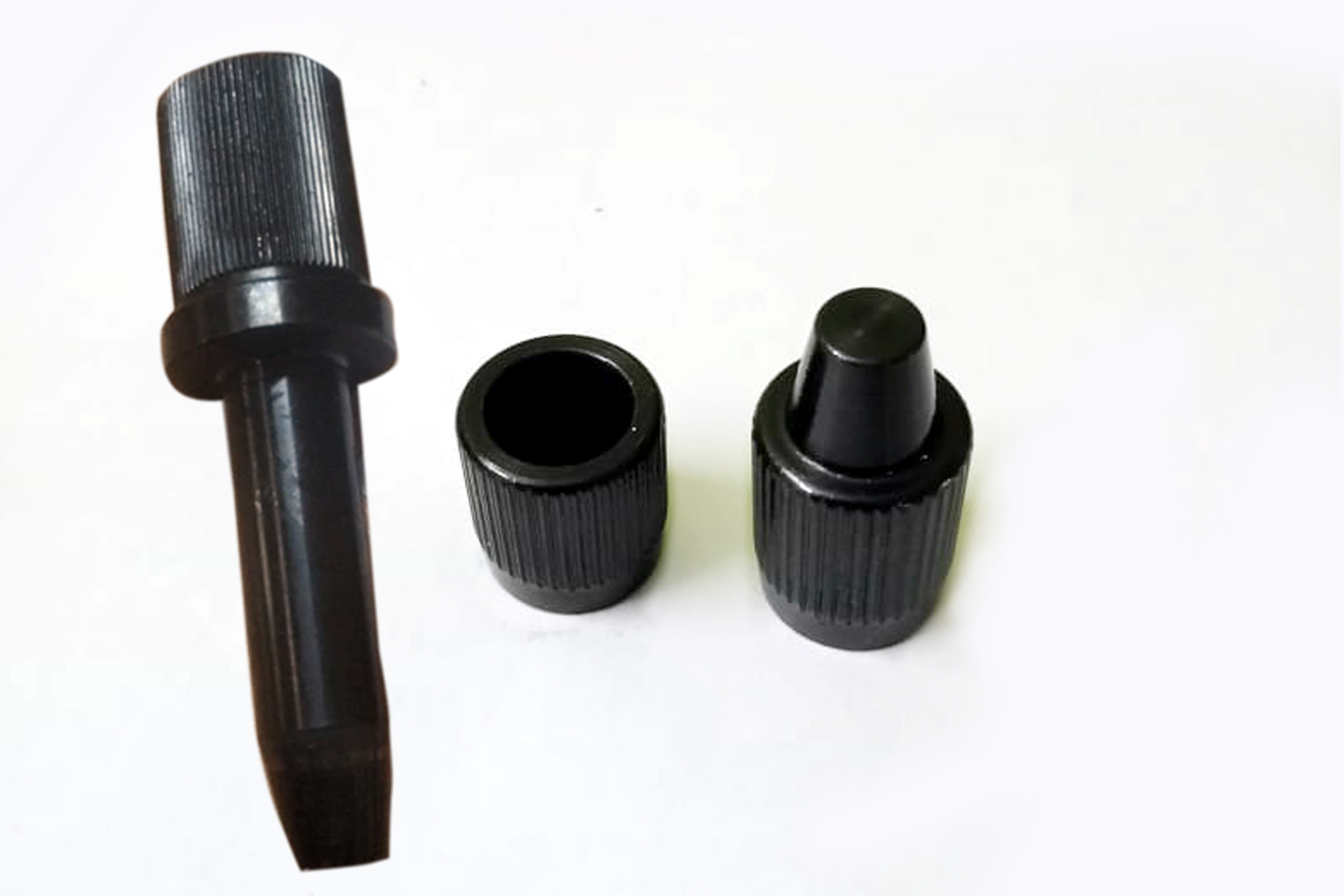 Engineer performing precision measurement on machined component